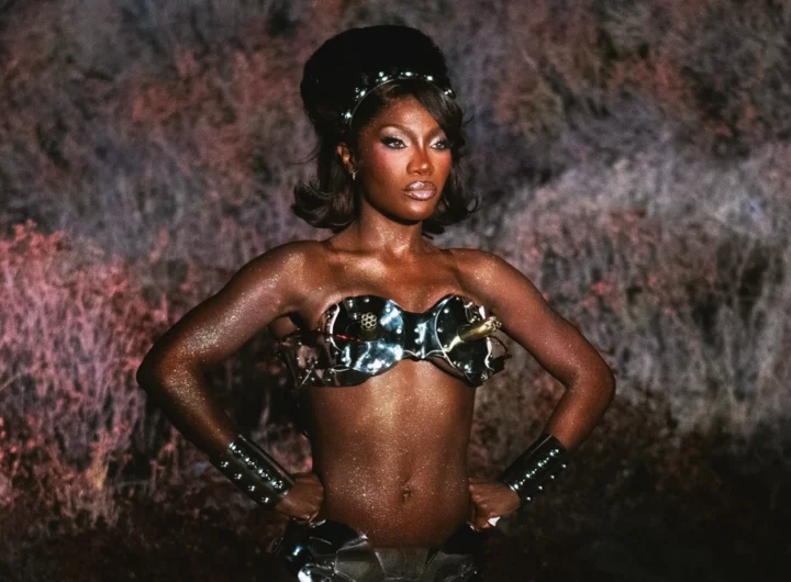 Doechii in a metallic fembot costume from the Bombs Swamp Sessions visual